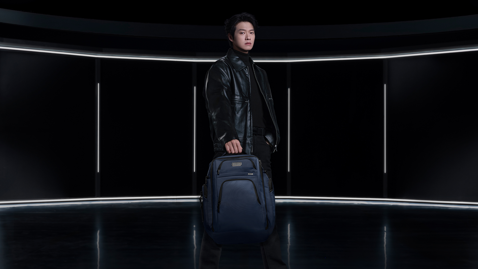 Wei Daxun pictured with the Alpha TUMI Brief Pack TM in Navy.