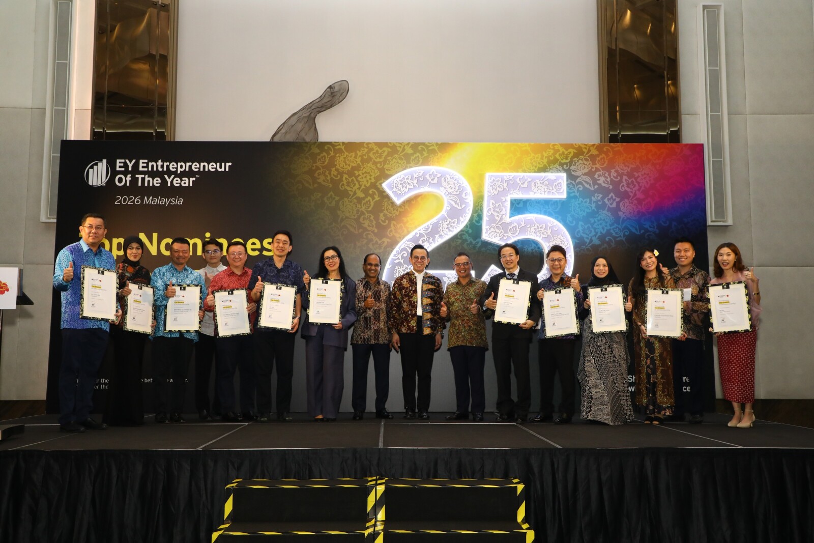 Minister of Entrepreneur and Cooperatives Development Steven Sim Chee Keong (eighth from right) with Top Nominees for the EY Entrepreneur Of the Year 2026 Malaysia awards