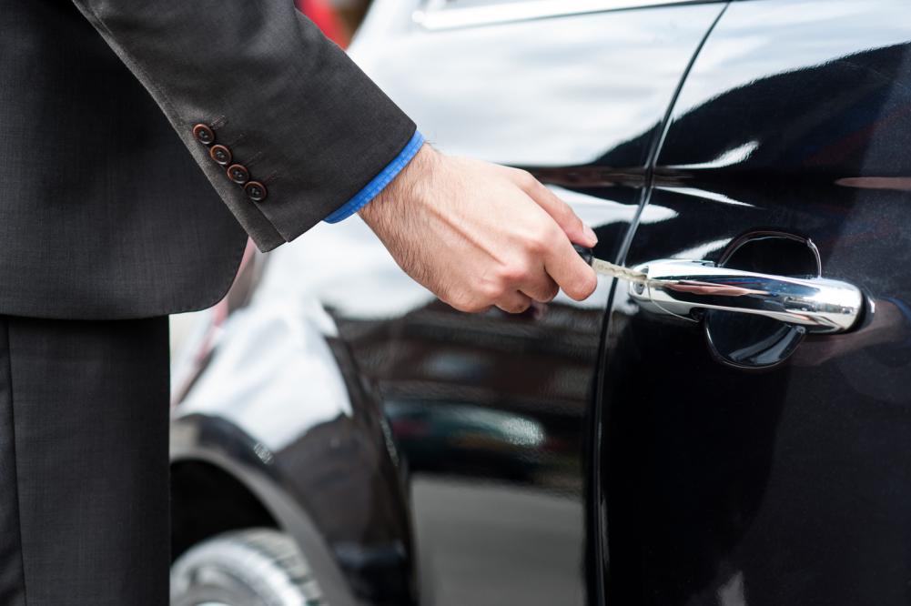 Man opening a car door